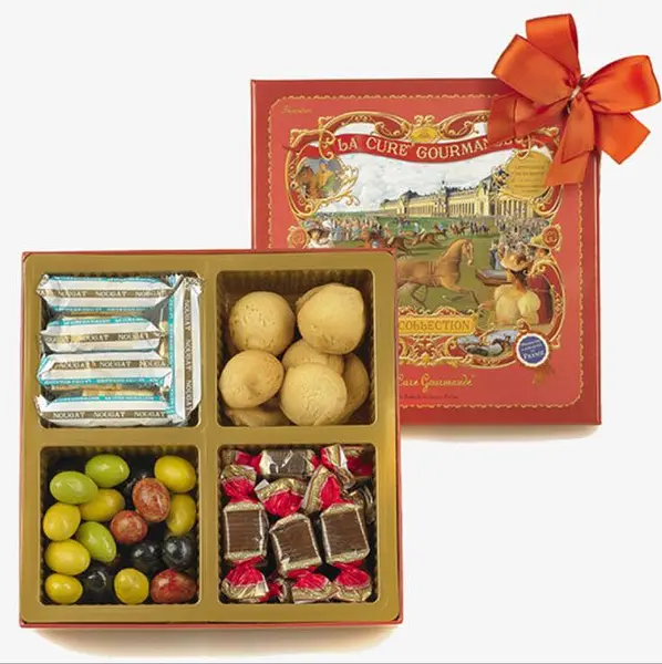 Coffret découverte composé: olives au chocolat, nougats traditionnels, caramels au chocolat et croquants biscuits fourrés au chocolat et à la noisette 